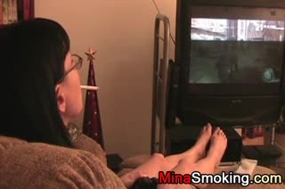 smoking and gaming sexy housewife on couch